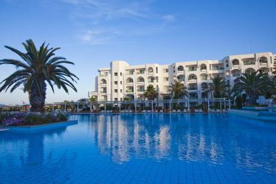 Swimming pool reflecting the hotel building at El Mouradi Mahdia Swimming pool reflecting the hotel building at El Mouradi Mahdia