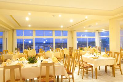 Restaurant dining room with sea view windows at El Mouradi Cap Mahdia Restaurant dining room with sea view windows at El Mouradi Cap Mahdia