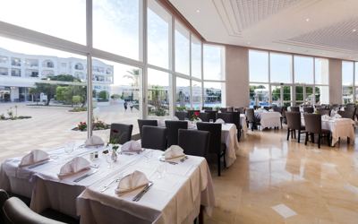 Restaurant with floor-to-ceiling windows at El Mouradi Gammarth
