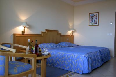 Double room with blue bedspreads at El Mouradi El Menzah Double room with blue bedspreads at El Mouradi El Menzah