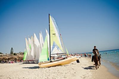 Sailing catamarans on the beach at El Mouradi Club Kantaoui Sailing catamarans on the beach at El Mouradi Club Kantaoui