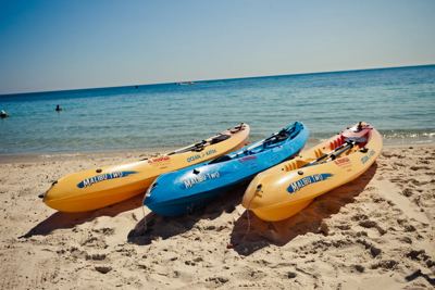 Kayaks on the sandy beach at El Mouradi Club Kantaoui Kayaks on the sandy beach at El Mouradi Club Kantaoui