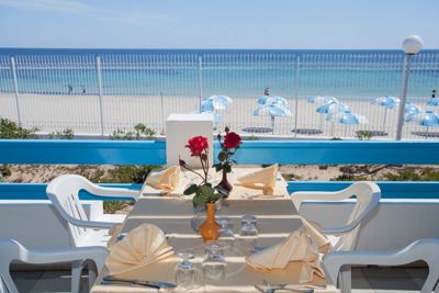 Restaurant terrace overlooking the beach at El Mouradi Club Selima Restaurant terrace overlooking the beach at El Mouradi Club Selima